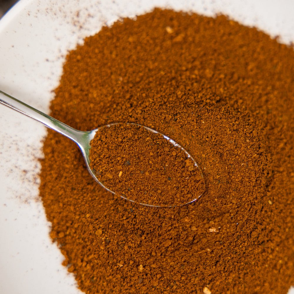 Close-up of a spoonful of finely ground Wild Alaska chaga powder